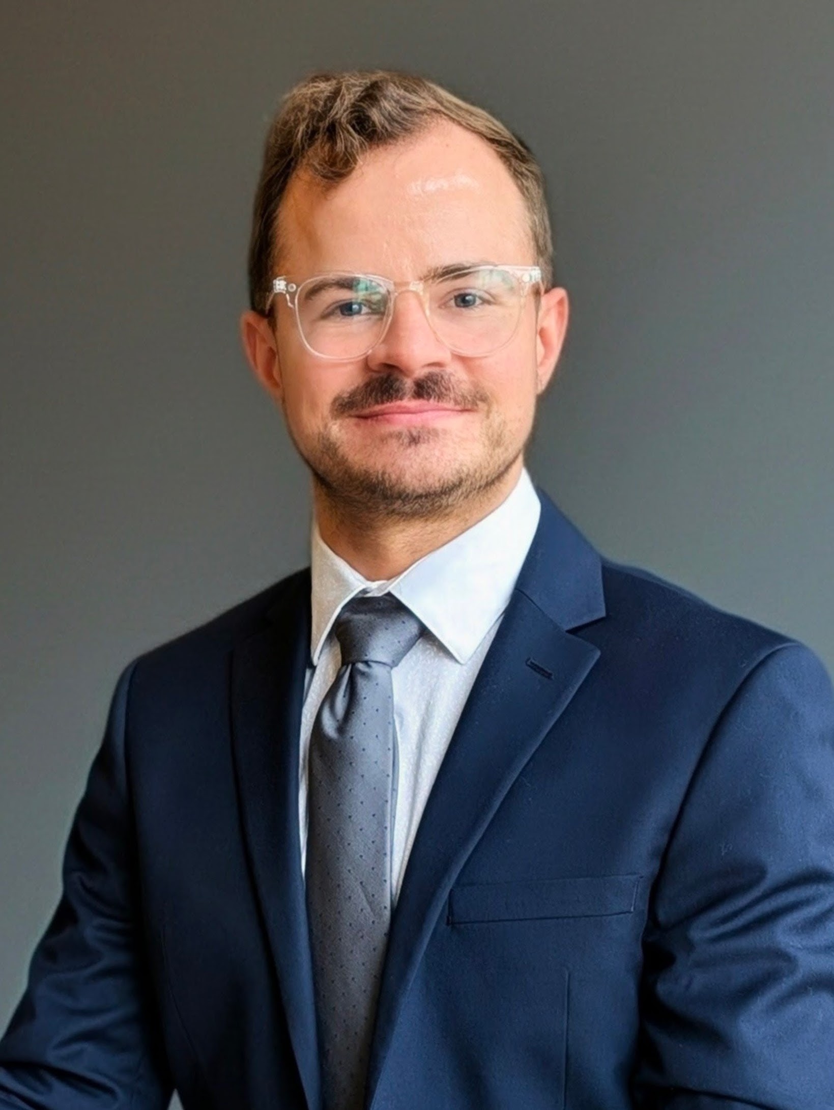 professional headshot photo of Levi Wolfe